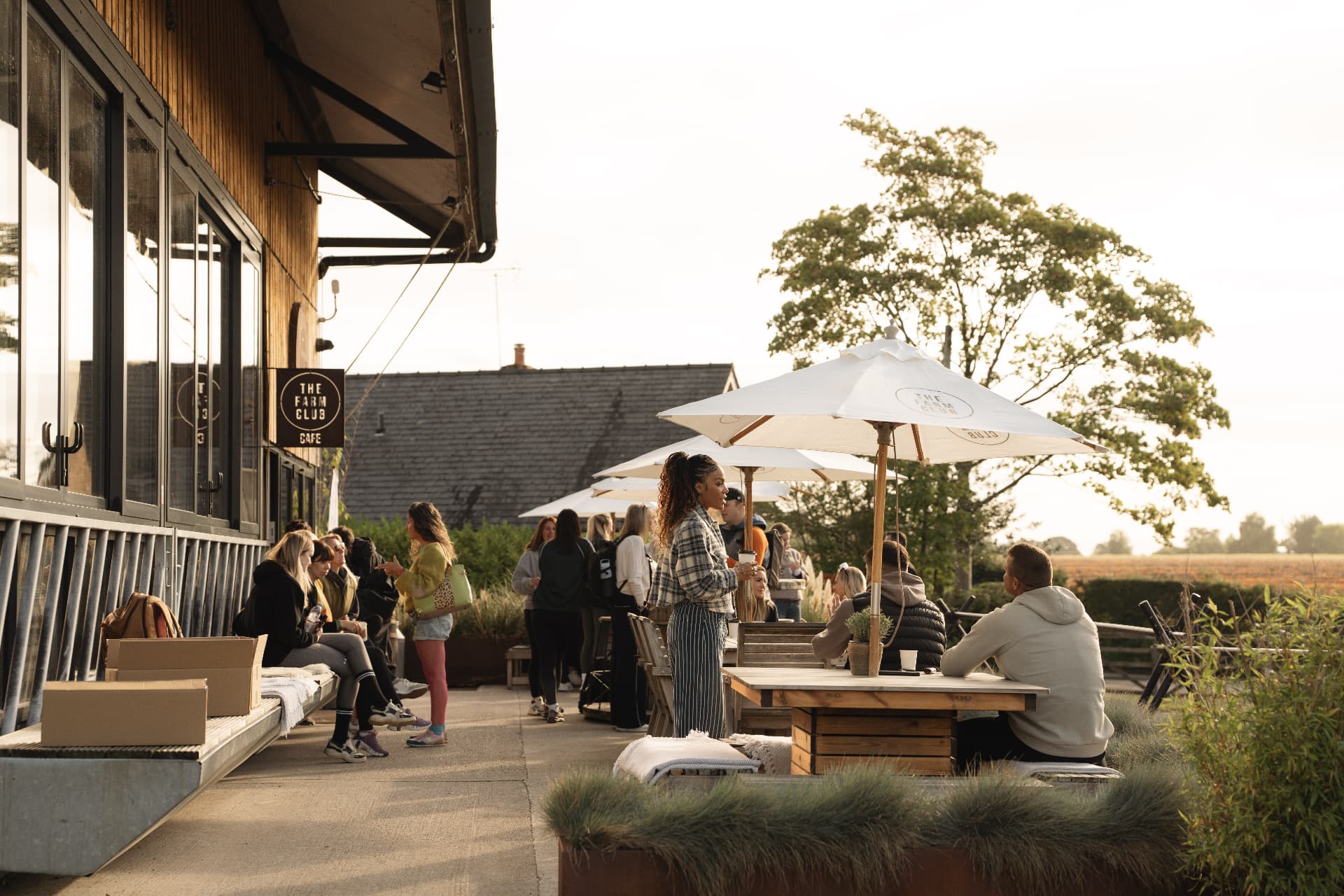 Guests relaxing on the café terrace in the evening sun