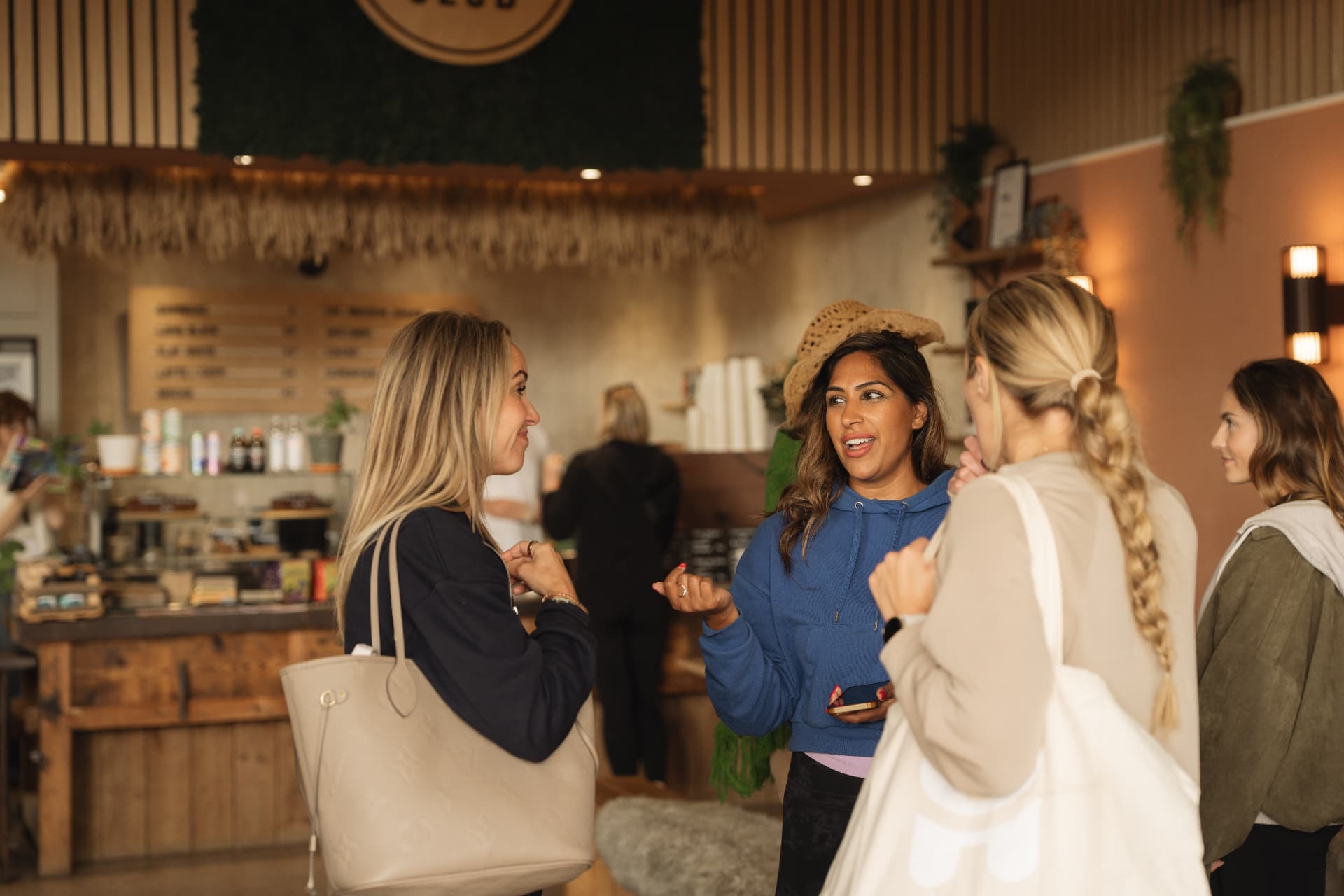Guests talking together in The Farm Club café